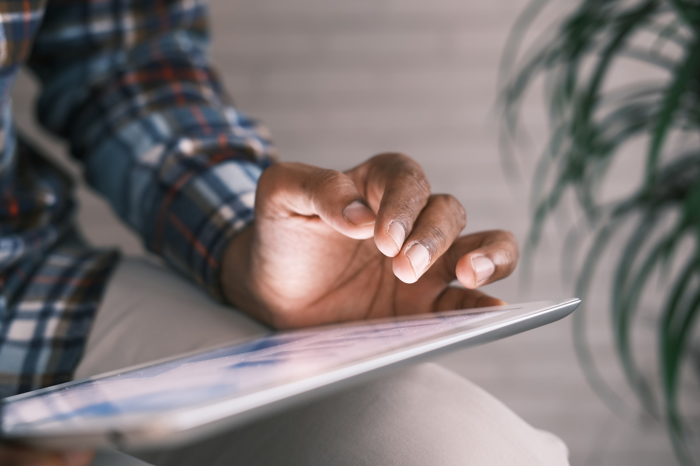 Man using an iPad to demonstrate the benefits of a visitor management system