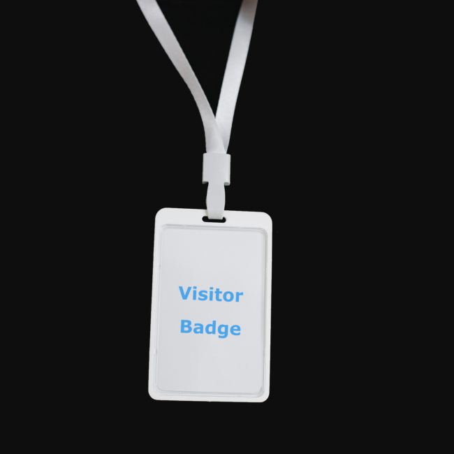 Visitor badge in a white lanyard